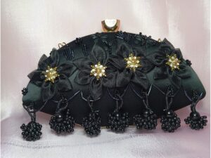 Black fancy clutch for women with fabric flower embroidery, gold crystal centers and black bead tassels