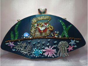 Teal ocean themed clutch for women with hand embroidered seashell, starfish and coral bead design