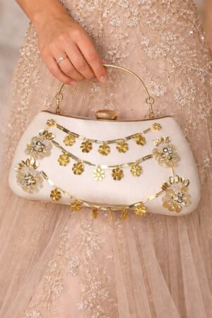 Elegant golden clutch with floral embellishments