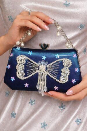 teal silver bow fancy embroidered clutch by clutchrose